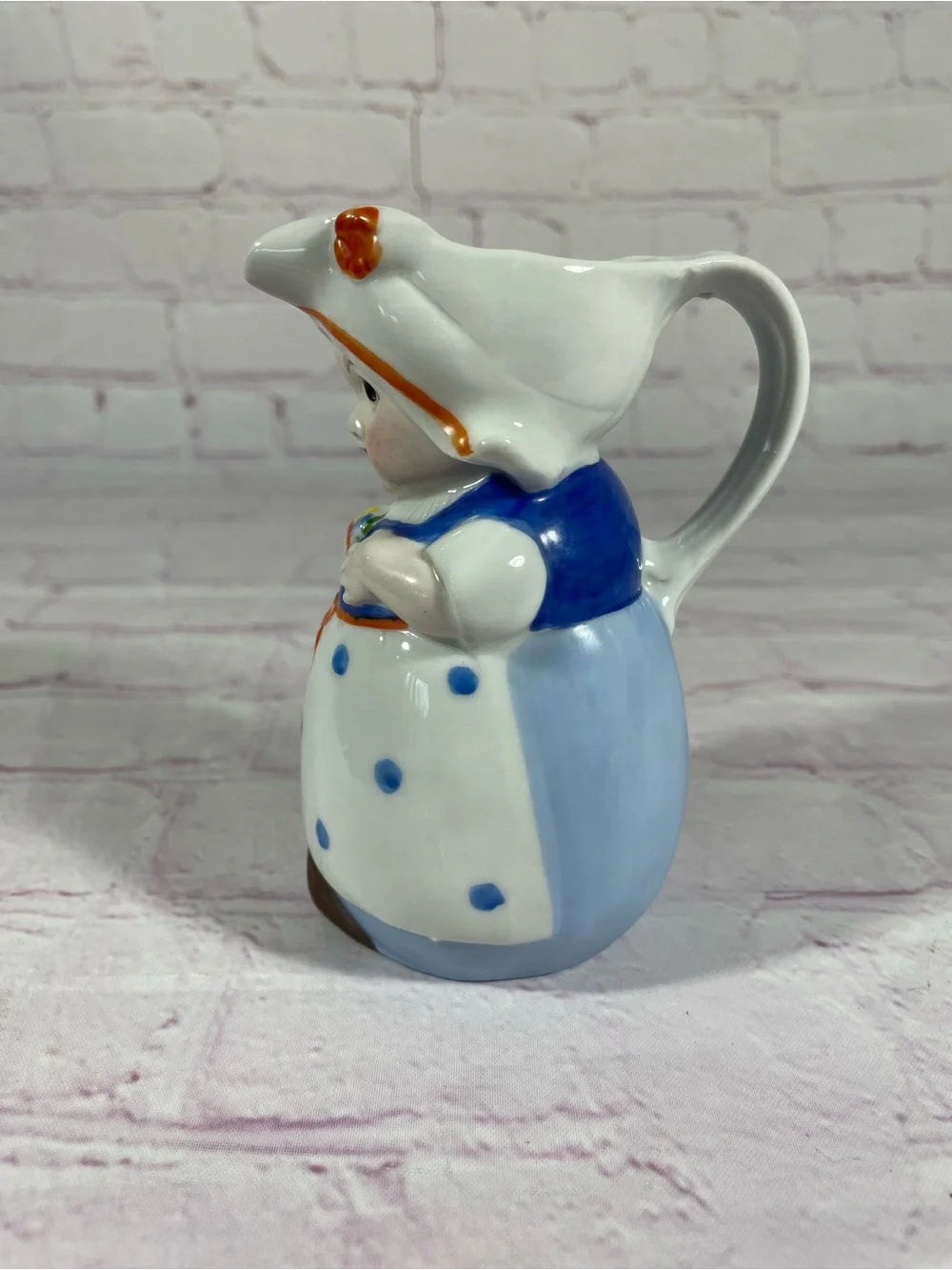 Vintage Dutch Girl Holding Flowers Hand Painted Ceramic Creamer Pitcher Germany